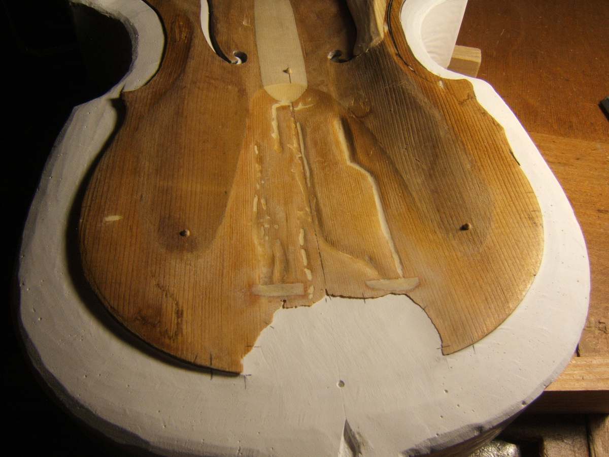 Inside of an old top supported in its plaster cast