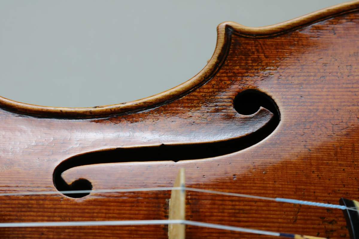 Soundhole of a new violin top, antiqued